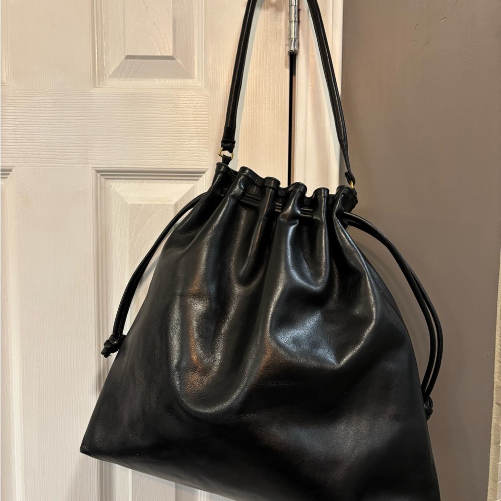 Clare V. Black leather draw string bag.